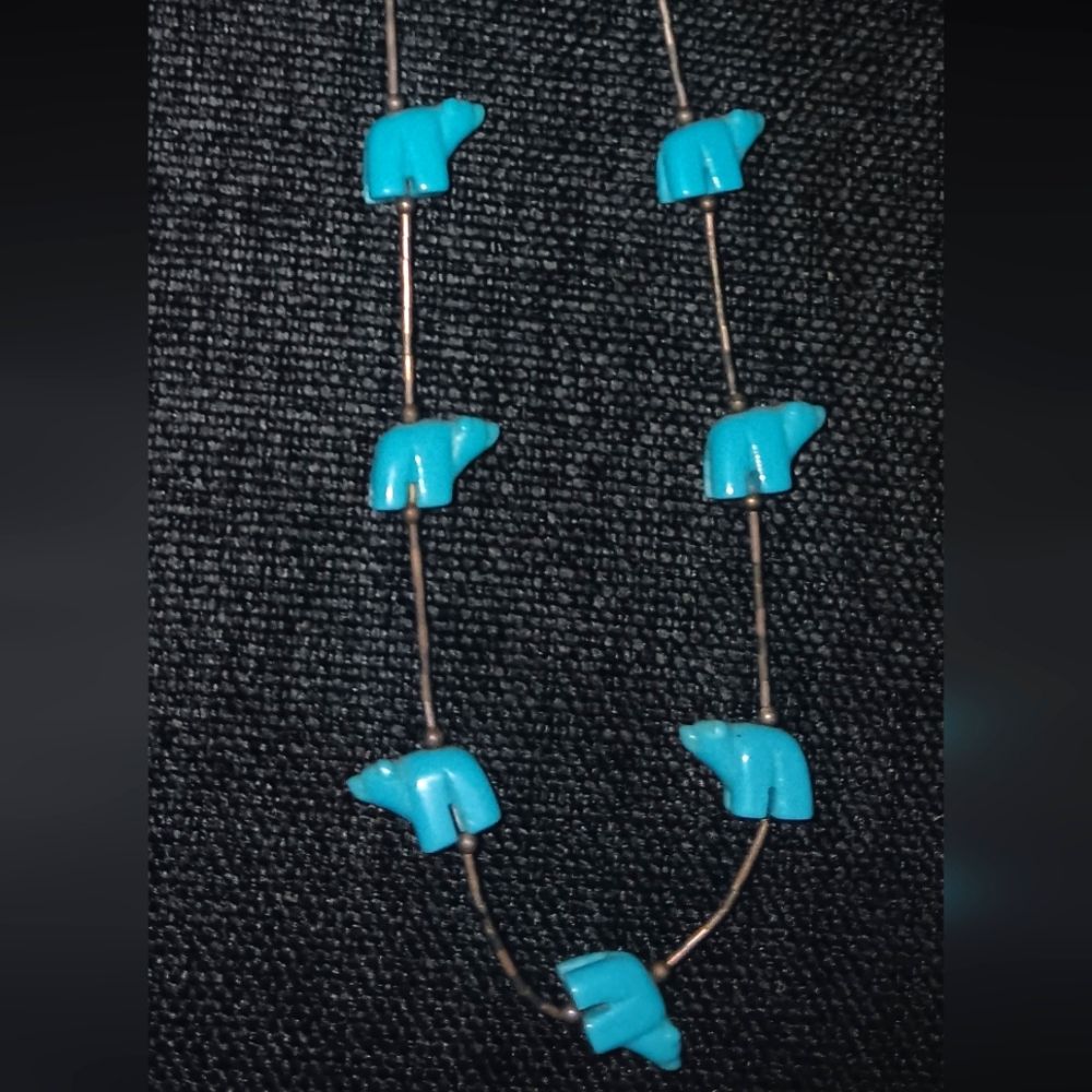 Turquoise bear stone necklace.